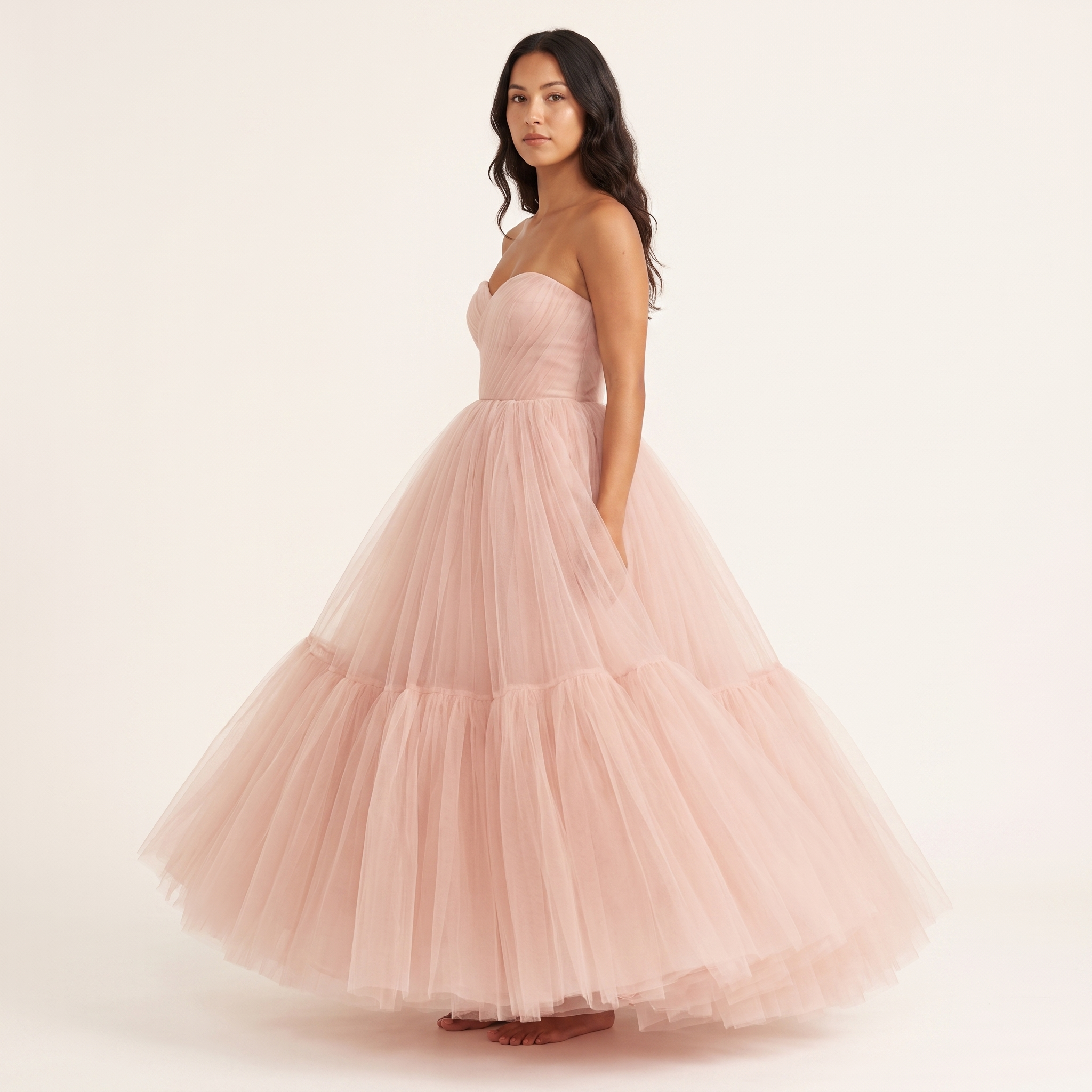 Blush pink tulle ball gown side three-quarter view