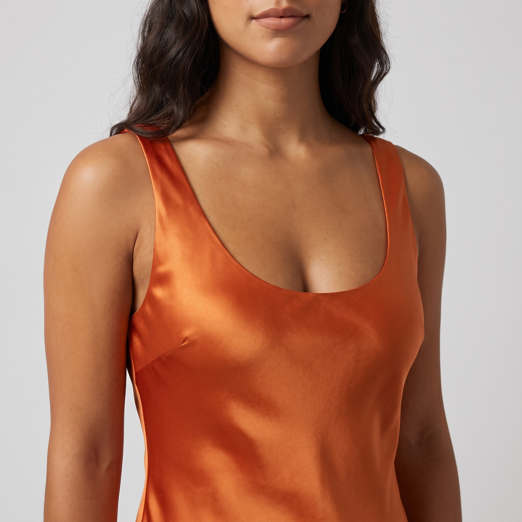 Orange satin mini dress neckline close-up